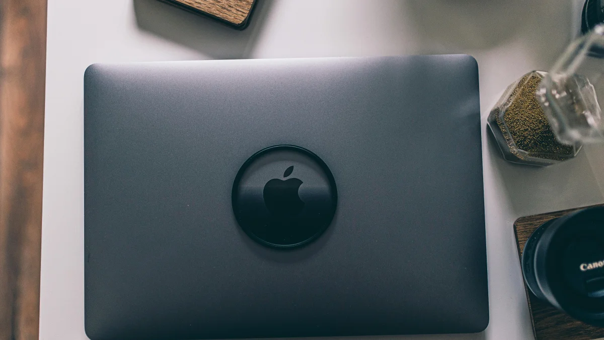 A macbook sitting on a table