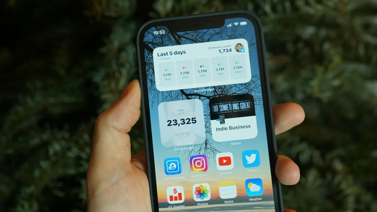 A phone showing widgets and apps