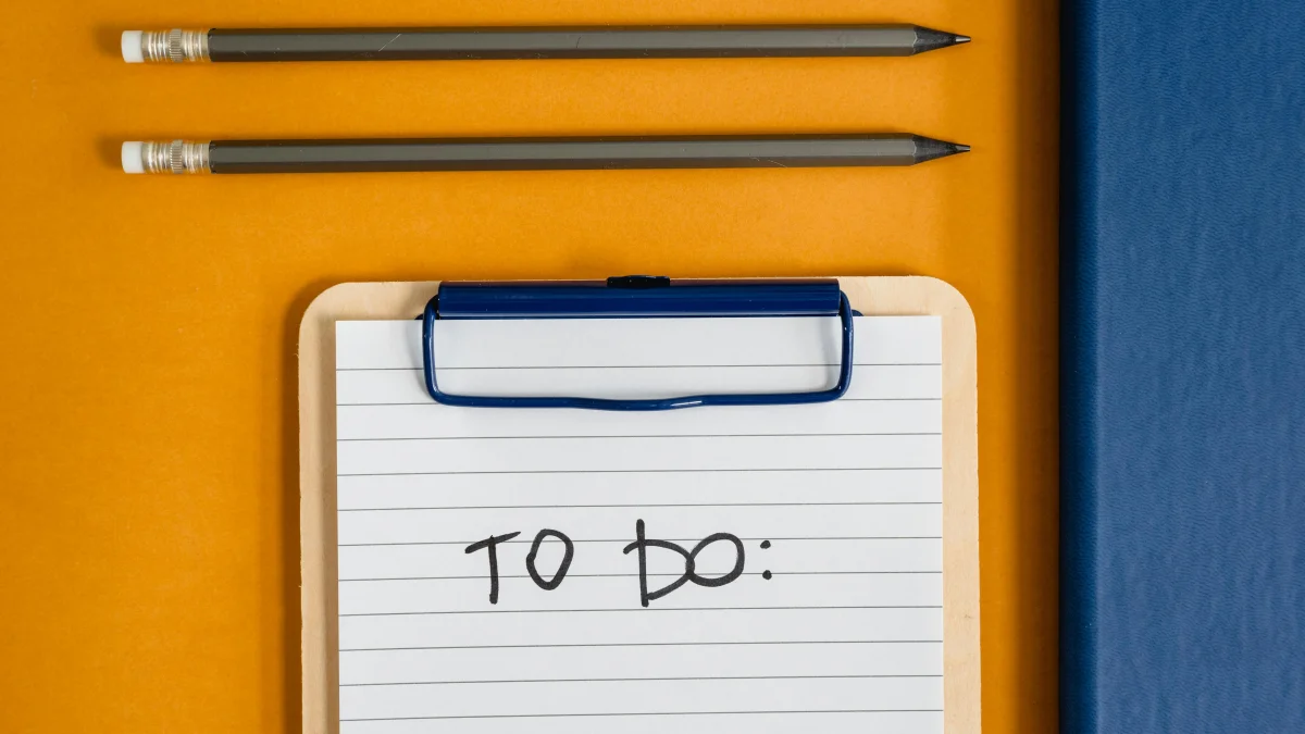 Pencils and To Do list on yellow table